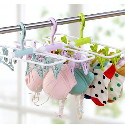 China Eco-friendly Material Mutifunction Foldable Plastic Hangers Clips with 12 Pegs Hanger for Socks Baby Clothes Bra Dryer for sale