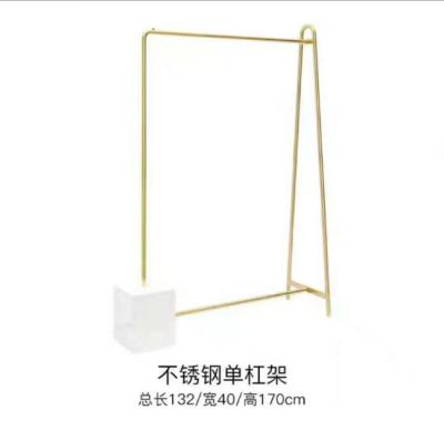 China Luxury Design Shelves For Clothing Stores, Luxury Boutique Store Metal Display Clothing Shelves for sale