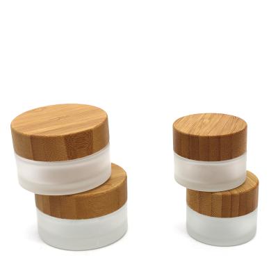 China Wholesale Skin Care Cream Eye Cream 15ML 30ML Glass Jar With Bamboo Wooden Lid For Travel for sale