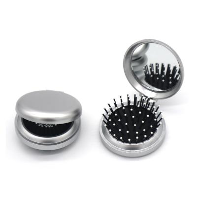 China Comfortable foldable hair brush and mirror in plastic housing for sale