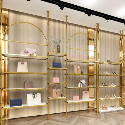 China One-stop design metal clothing display stand gold women's clothing display rack women's clothing store design ideas for sale