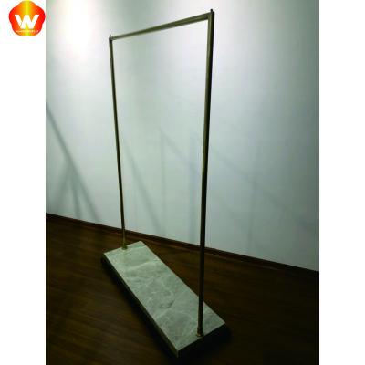 China Multifunctional new one-stop design design with base storage hanger gold standing display racks for clothing store for sale