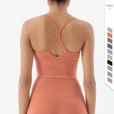 China Breathable Hot Seamless Yoga Bra Skin Friendly Breathable Quick Dry Strappy Custom Logo Fitness Top Women Cross Back Sport Yoga Bra for sale