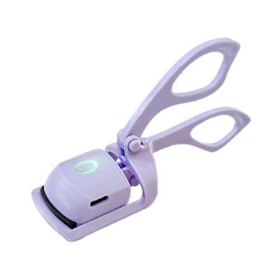 China Passionate Electric Rechargeable Eyelash Curler Two Mode OEM Passionate Box Mini Purple Eyelash Curler for sale