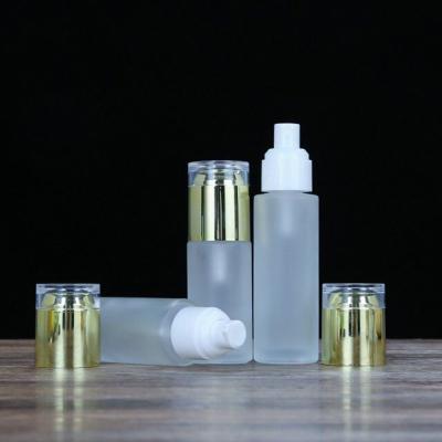 China Custom Cheap 50ml Cosmetic Empty To Bottle Essence Lotion Frosted Glass Bottle With Pump Sprayer Lid for sale