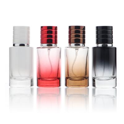 China 30ml 50ml Cosmetic Luxury Round Shoulder Flat Gradient Color Empty Glass Perfume Bottle Cosmetic Packaging With Spray Top for sale