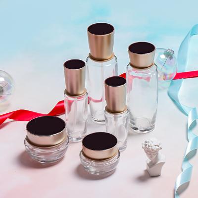 China Wholesale Cosmetics Eco-Friendly Glass Jar With Gold Lid 30g 50g 30ml 50ml 100ml Aluminum Clear Round Glass Container for sale