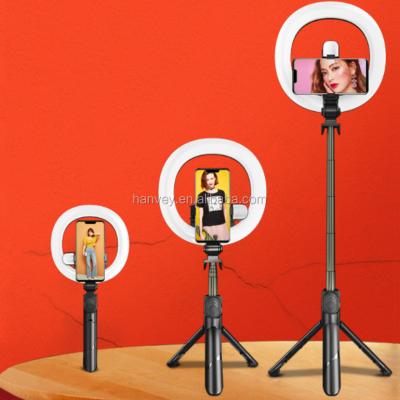 China Portable foldable lipstick built-in mobile phone tripod stand more remote extendable portable BT radio mini palo stick selfie stick for sale