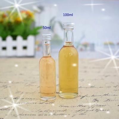 China Eco-friendly Recyclable Wholesale Empty Fruit Drink Mini Wine Bottles With Seal Caps 50ml 100ml for sale