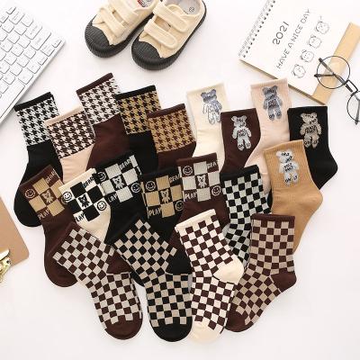 China Hot Sale Sports Children's Socks Autumn And Winter New Smiley Green Printed Kids Mid Cotton Checkerboard Combed Tube Socks for sale