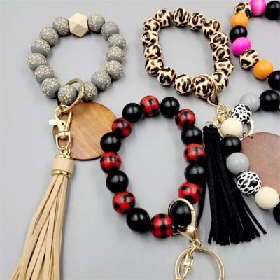 China Fashion Amazon Etsy Wooden Key Ring Wristlet Keychain Bracelet Silicone Beaded Car Keys Ring For Women for sale