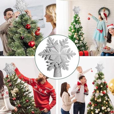 China Christmas Party Decoration Christmas Tree Topper Lighted with Silver Snowflake Projector Led Rotating Magic Snowflake for Christmas Tree Decorations for sale