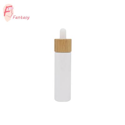 China China 30ml 50ml 100ml Cylinder Cosmetic Bottle Serum Bottle Eco-friendly White Luxury Glass Bamboo Rubber Pipette Bottle Cap for sale