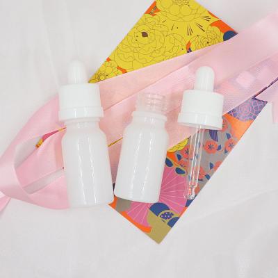 China Cosmetic Custom Painted Glossy White Glass Dropper Bottle 10ml 15ml Luxury Essential Oil Glass Bottles for sale