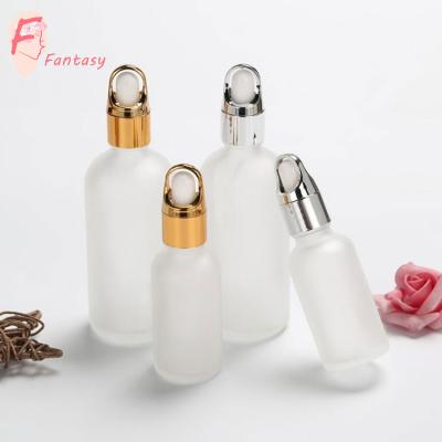 China Cosmetic 5ml - 100ml Frosted Matte White Essential Oil Glass Bottle CBD Glass Bottles With Gold Silver Dropper Cap for sale