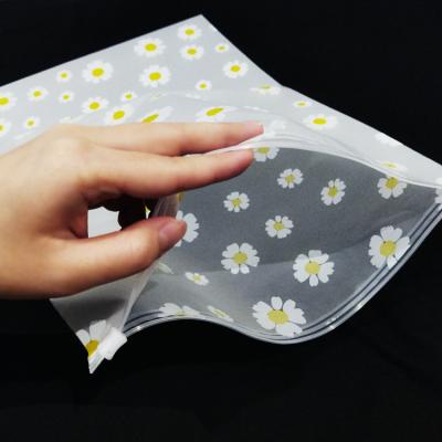 China Daisy Print Transparent Plastic Clothes Eyelash Package Zipper Top Zipper Lock Packaging Bag Recyclable for sale