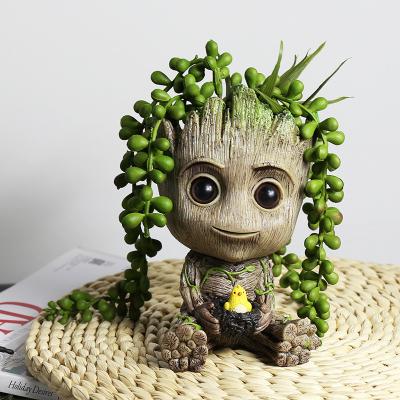 China Modern Creative Cute Potted Internet Celebrity Small Groot Brazilian Wood Planting Flower Pot Balcony Garden Decoration Cartoon Tree M for sale