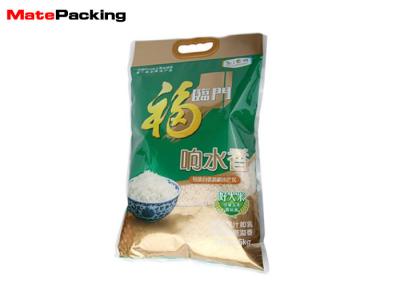 China Bolsos plásticos de la comida del sello de vacío del arroz 5kg con la manija cortada con tintas sellada 3 lados en venta