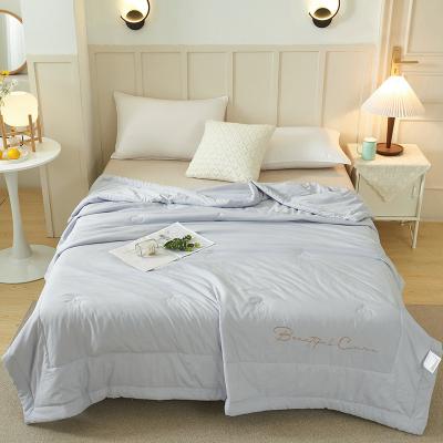 China Customized Viable Quality Summer Lightweight Cool Embroidery Bed Solid Prewashed Quilt for sale