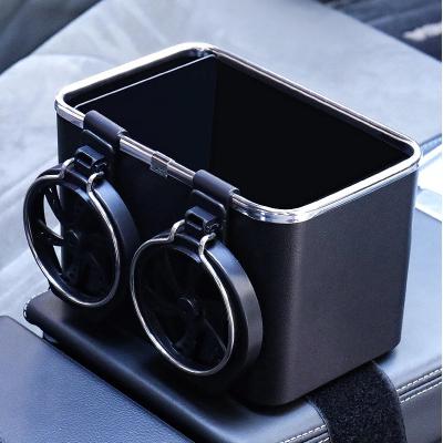 China Modern Wholesale Portable Napkin Case Multifunctional Car Tissue Box Organizer Plastic Car Paper Storage with 2 Cup Holder Foldable for sale