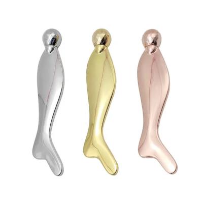 China Whitening Fish-Shape Rose Gold Metal Gua Sha Massage Stick Face Roller Massage for sale