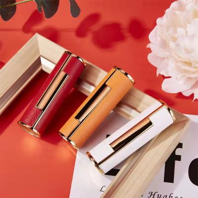 China JIE MEI Stock MOQ 100PCS White Leather Cosmetic Red Orange Pop Up D12.1MM Empty Lipstick Tube Gold Plastic Metal Lipstick Container for sale