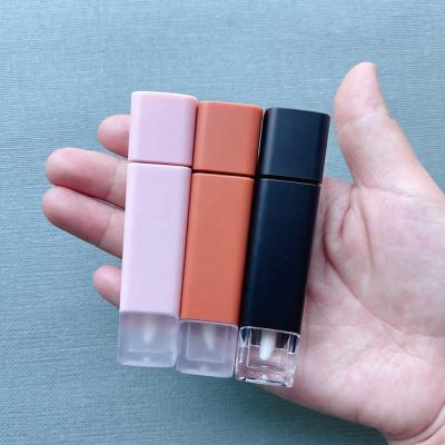 China JIE MEI Stock Best Price Matte Square 5ML Empty Liquid Lipstick Container Cosmetic Black Pink Brown Frosted Bottom Lip Gloss Tube for sale