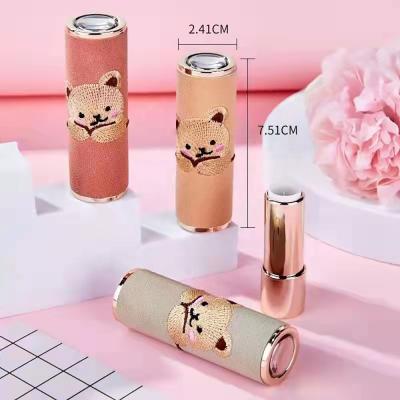 China JIE MEI Bear Pink Green Lipstick Tube D12.1MM Cosmetic Cute Embroidered Yellow Leather Empty Lip Balm Container Stock MOQ 100PCS for sale