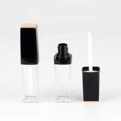 China JIE MEI Stock Wholesale Shiny Black Golden Lip Topper Cosmetic Metallic Empty Gloss Container Custom Lip Gloss Wand Tube With Cap for sale