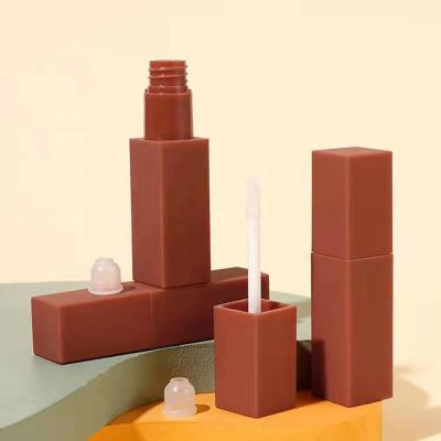 China JIE MEI Stock Wholesale Matte Reddish Brown 7ML Lip Gloss Wand Cosmetic Empty Tube Square Lip Gloss Container With Cap for sale