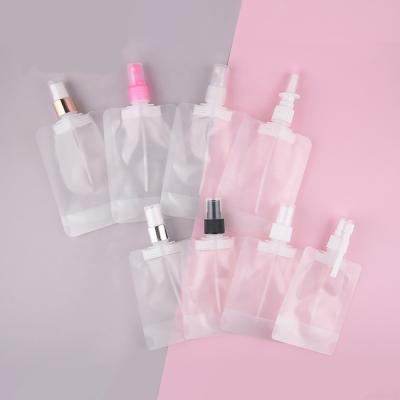 China JIE MEI Stock Cosmetic 50ml 100ml Plastic Packaging Cosmetic Liquid Bag With Sealed Suction Spout Stand Up Bag With Sprayer for sale