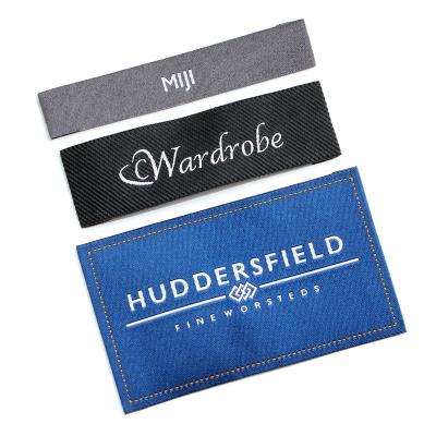 China Washable high end quality brand name letter name custom apparel textile labels supplier machine folded loom satin woven labels for sale