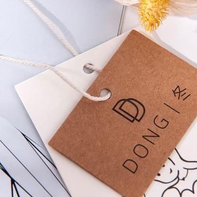 China Wholesale Fashionable Custom Logo Recyled Recycled Luxury Garment Accessories Brand Embossed Clothes Label Tag Paper Hang Tag For Clothing for sale