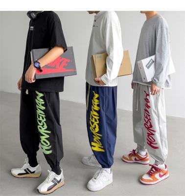 China nylon/cotton Anti-wrinkle print custom logo gym sweatpants sports loose trousers for men's jogger pants for sale