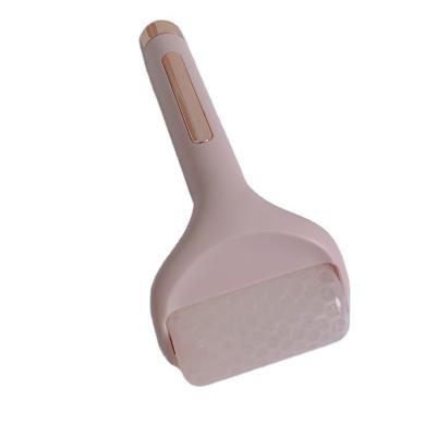 China Anti-Puffiness Face Lift Pink Roller Compress Cold ABS Face Ice Roller For Home for sale