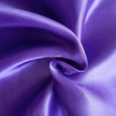 China Brandschutzstoff 100% Polyester Gewebe aus Gold Satin für Bekleidung zu verkaufen