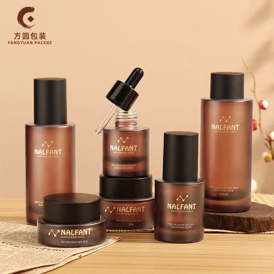 China New Arrival Amber Glass Jars Lotion Serum Bottles Pump Bottle Glass Cosmetic Matte Amber Cream Bottles For Face Cream for sale