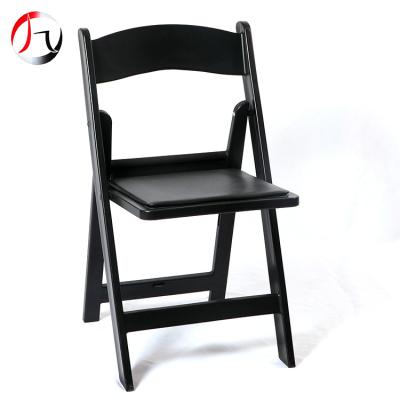 China Modern Wholesale Black Padded Plastic Resin Folding Wimbledon Chair For Outdoor Wedding Events for sale