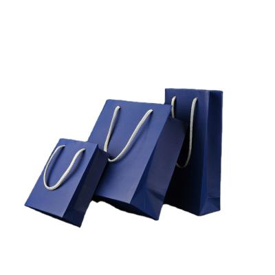 China Luxury Recycled Materials Paper Gift Bags For Craft 250gsm Art Paper Eyewear Blue Watch Shopping Bags Can Be Customized Your Logo Design for sale