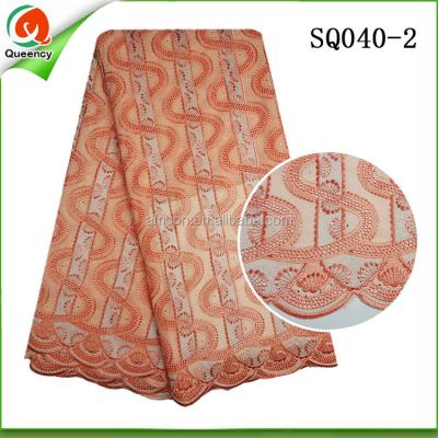 China Large Dubai Market Sustainable Swiss Voile Lace Fabric 100% Cotton Lace Fabric Textile In Peach Color for sale