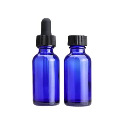 China Cosmetic 2 oz Boston bottle 30ml blue glass bottle essential oil bottles with dropper for sale