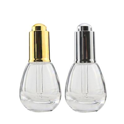 China Wholesale Personal Care Water Droplet Shape Glass Pressure Pump Bottle 20ml Essential Oil Glass Bottle Serum Bottle With Pressure Pump for sale