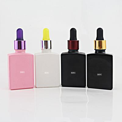 China Personal Care 30ml Personal Care Serum Bottle Rose Square Essential Oil White Black Flat Glass Dropper Bottle for sale