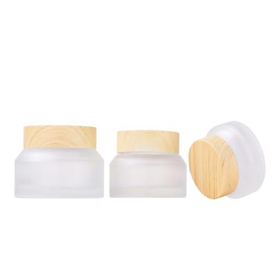 China Top grade cosmetic glass cream jar 15g 30g 50g tipped shoulder glass cream is used for cosmetic cream for sale