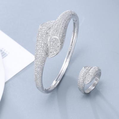 China Exquisite Luxury Hyperbola Women Jewelry Set Iced Out Cubic Zirconia Bracelet Ring Set Dubai Gold Plated Jewelry for sale