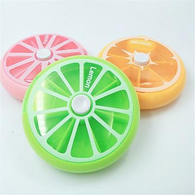 China ABS Plastic Lemon Pill Box Orange Fruit Shape 7 Days Push Up Travel Rotatable Pill Box for sale