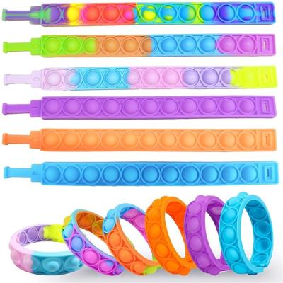 China Sensory Multiple Color Options Wrist Silicone Therapy Newest Release Stress Integration Rings Sets Pink Sticky Person Wristbands For Worry for sale