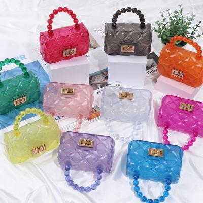 China New Water Resistant Children Kids Pocket Transparent Jelly Handbag Mini Maca Bag for sale