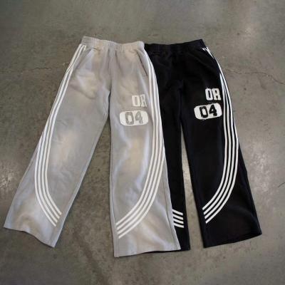 Chine Sweatpants à taille haute pour hommes avec bandes latérales et logo personnalisé à vendre