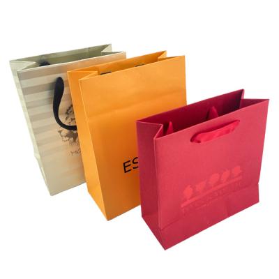 China Biodegradable Custom Design High Quality Luxury Gift Special Paper Packaging Bag With Handle Business Shopping Kraft Paper Bag for sale